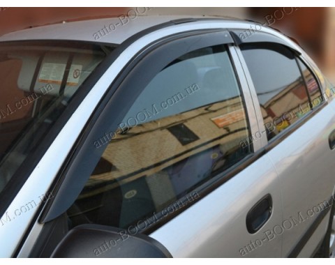 Дефлекторы окон на Mitsubishi Carisma 95-04 (Cobra Tuning)